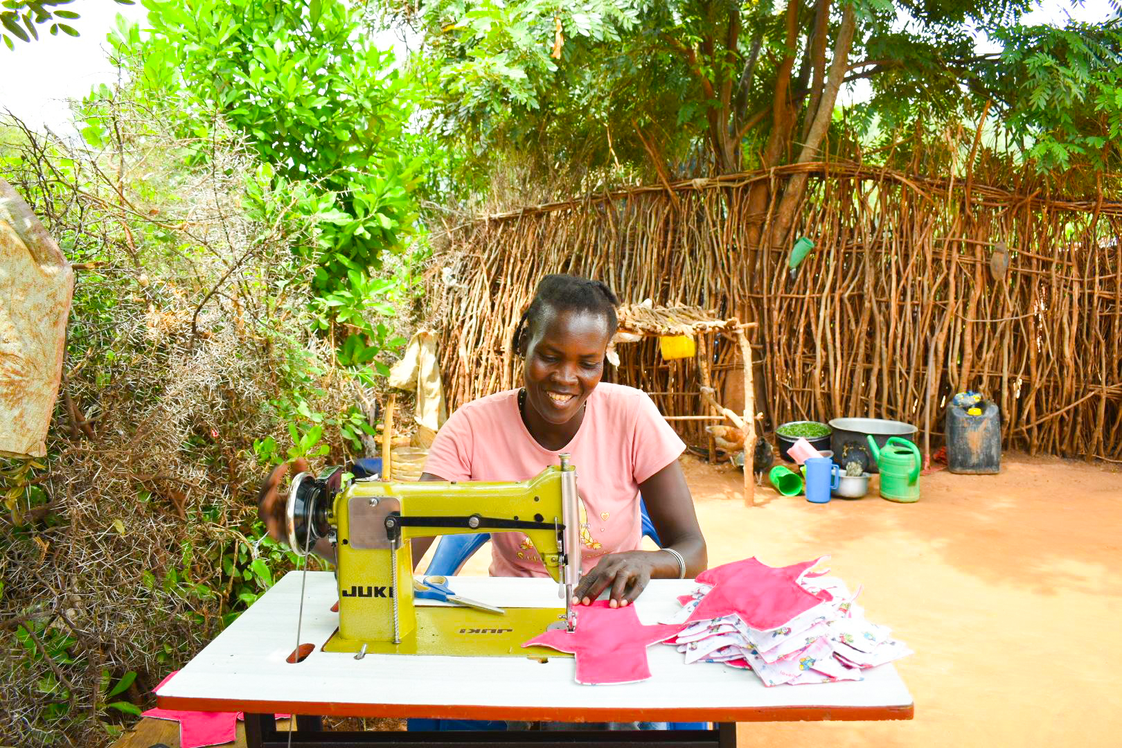 A person working on their sewing machine.