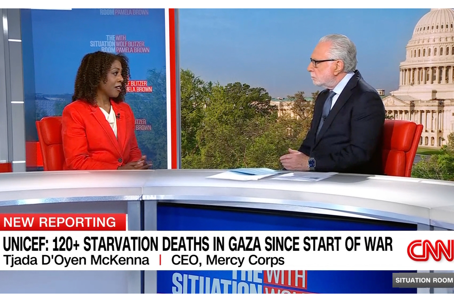 Mercy corps ceo being interviewed by cnn anchor.