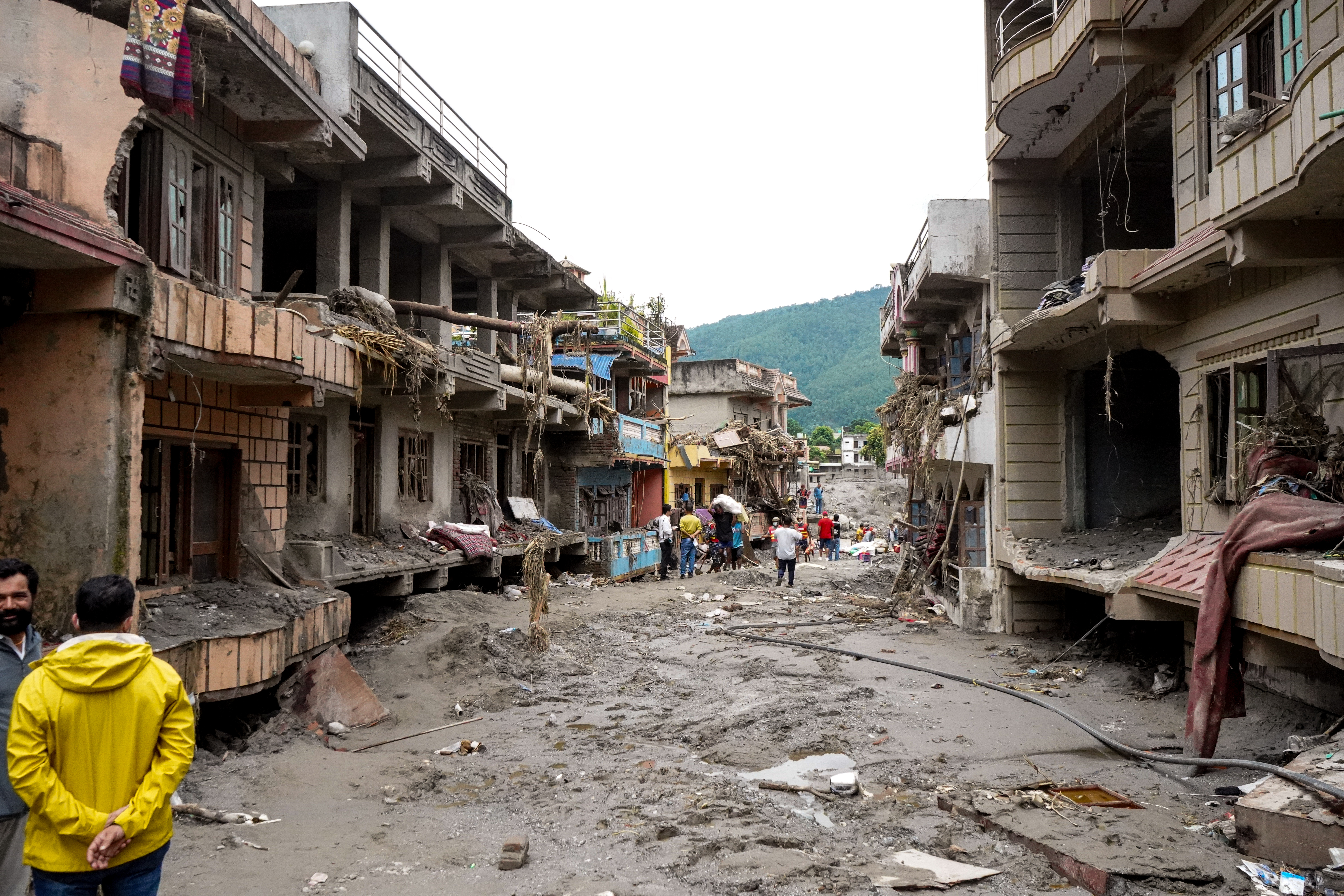People assess damage in rasuwa district, bagmati province in the wake of the devastating flood in northern nepal.