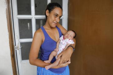 Yamirsa cradles her 1-month-old daughter, jaylenet.
