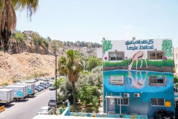 An art mural promote water conservation in amman by artists wesam shadid and ibrahim tonnerieux.