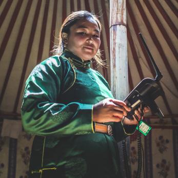 Woman in mongolia with a drone