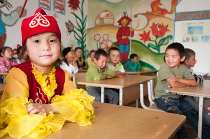 Children seated at desks in school in kyrgyzstan