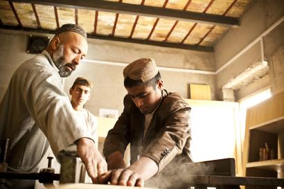 A young man participating in a carpentry class in afghanistan