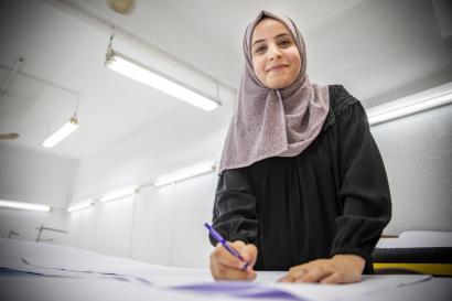 Mona al-omari is a dress designer in gaza. she has worked at this shop since february 2019, an opportunity that was made possible because the company expanded after working with mercy corps' livelihoods programme