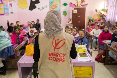 Mercy corps employee speaks to classroom