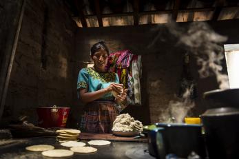 A woman making tortillas in guatemala