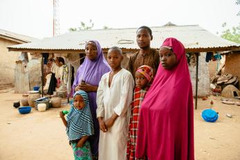 A family standing outdoors in nigeria
