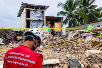Sulawesi team member surveying damage of earthquake