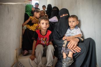 Mothers and their children wait at a mercy corps' clinic, 2018.