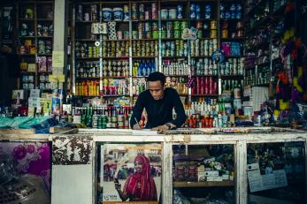 Man standing behind the counter of his shop in ethiopia