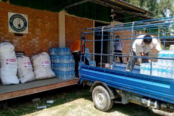 Supplies being unloaded from a vehicle.