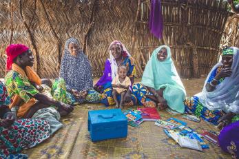 Each week, these women meet to deposit money as part of their village savings and loan association group, which they later distribute to different members of the group as investments or in times of need.