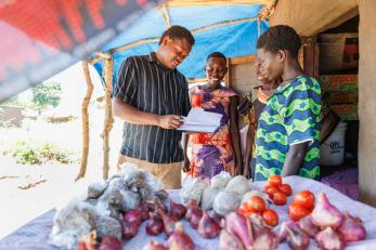 A business mentor from village enterprise visits the saidu business group which was formed by three women refugees.
