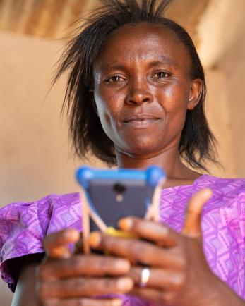 Kenyan woman with phone.