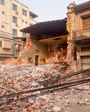 Urban scene with destroyed building as subject.