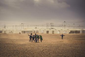 Boys playing near shelters at a refugee camp in Jordan