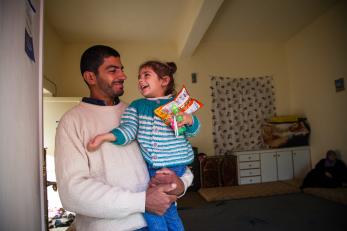 Syrian refugee father and daughter.