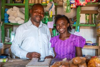 Lydia and her husband at their small shop. Lydia relies on rain-fed agriculture to support her family, a livelihood that has become increasingly fragile with the growing effects of climate change. Photo: Ezra Millstein for Mercy Corps