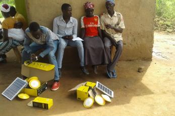 people with unboxed solar energy supplies