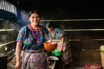 Two women cooking in Guatemala. Photo: Miguel Samper for Mercy Corps