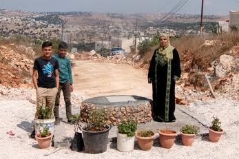 A family with their new pear-shaped well.