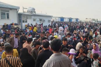 Afghanistan community members assembled in public space.
