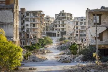 Damaged buildings line the streets, in an area on the outskirts of Aleppo that was heavily bombarded during the civil war.
