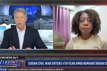 screenshot of Mercy Corps CEO with CBS journalist during tv interview..