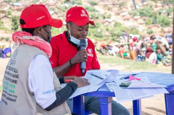 The SAFER humanitarian team calls participants during a multi-purpose cash distribution.