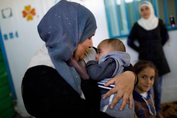 Eman holds her 3-month-old son, Anas, who was born in Zaatari.