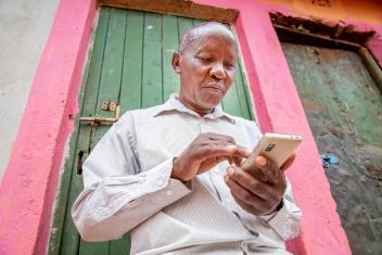 Matheka Munyao, and many Kenyan farmers like him, use our DigiFarm platform to access farming data and combat the growing risk to their crops caused by climate change. PHOTO: Ezra Millstein/Mercy Corps