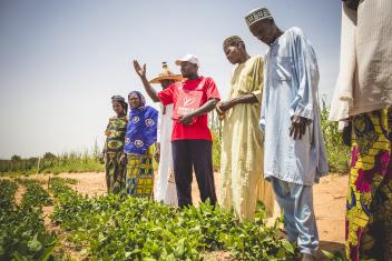 Mercy Corps trainer Zakaria works with farmers in a Niger village to test varieties of beans and fertilisers so they can grow the best crops as quickly as possible. PHOTO: Sean Sheridan for Mercy Corps