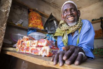 Adamu and his family had to flee their home in Nigeria and rebuild their lives. We gave him a grant to sell goods to his community, and he is now able to feed his large family. PHOTO: Ezra Millstein/Mercy Corps
