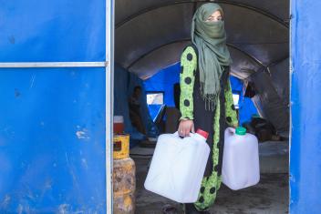When fighting broke out, 15-year-old Freeal left her farm with her family and ran to a displacement camp, where they have lived since January. Now she and her siblings wait in line each morning and evening for water, using jerrycans her family received as part of a Mercy Corps distribution.