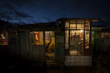 In Kenya, a barbershop and butcher can stay open after dark with electricity from a mini-grid.