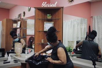 Regina Morgan in her Vancouver, Washington salon, where her hair braiding business received a COVID‑19 relief grant to help her salon thrive.