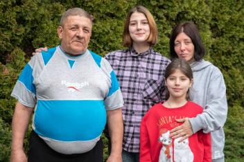 Anjela Rabova (far right), stands with her father, Artyr, and two daughters. After sheltering in a cold, dark basement below their home, they fled Kharkiv to arrive in Warsaw, Poland. They are staying in a room funded by a Mercy Corps partner organisation. “Life is divided into before and after [the war]. We need to start life from the beginning,” said Anjela. 