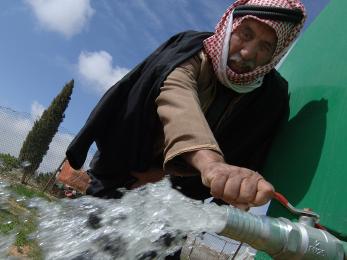 Man at water tap in jordan