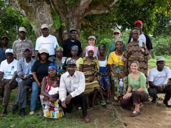 Mercy corps staff and beneficiaries at an 80-acre cocoa farm that we're working to rehabilitate in grand bassa county, helping farmers re-establish it as a new business.