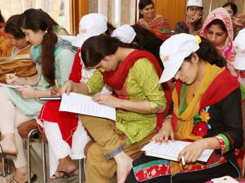 Women in pakistan in a meeting
