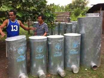 Mario de jesus (at left, in blue shirt) and other local blacksmiths are benefitting from mercy corps' secure program by building silos for sale to neighboring farmers. photo: wahyu nugroho/mercy corps