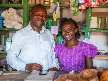 Lydia and her husband at their small shop. lydia relies on rain-fed agriculture to support her family, a livelihood that has become increasingly fragile with the growing effects of climate change. photo: ezra millstein for mercy corps