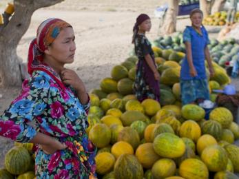 Women standing around their produce