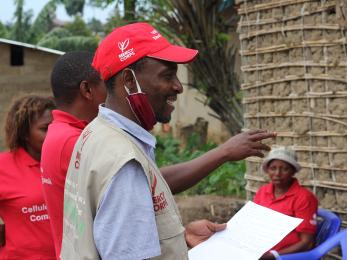 Mercy corps representatives speaking together. 