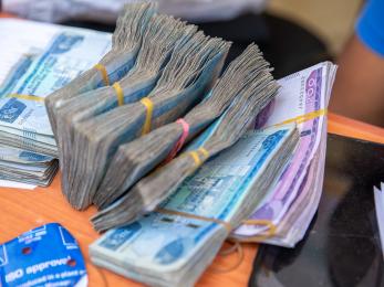 Bundles of currency on a table.