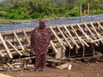 Woman standing in front of local infrastructure project.