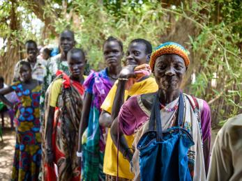 People in south sudan wait in line for a cash distribution