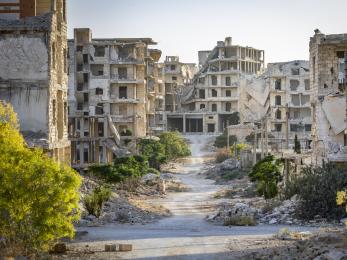 Damaged buildings line the streets, in an area on the outskirts of aleppo that was heavily bombarded during the civil war.